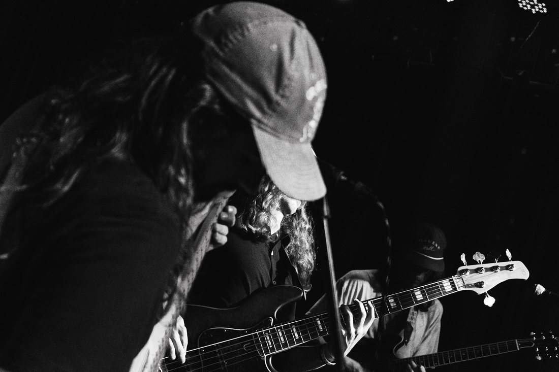 Guitar, head down, on stage
